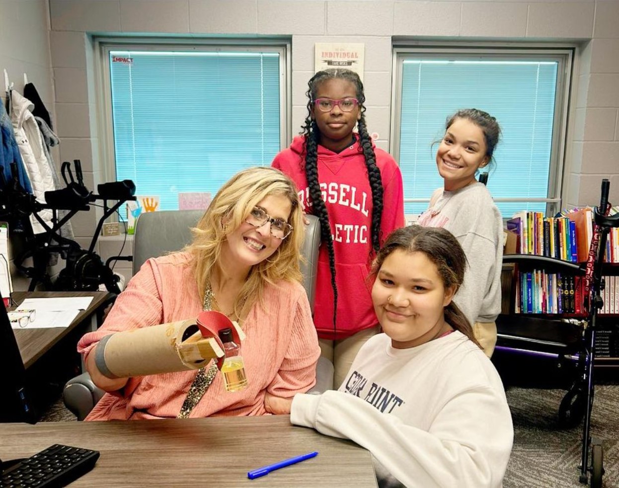 Kristin Fox with three of her students