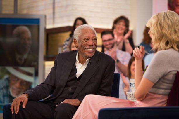 Morgan Freeman on talk show, sharing wisdom with a warm smile