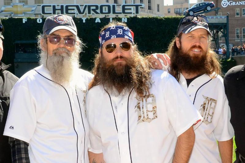 Phil Robertson and 2 of his sons pictured wearing baseball uniforms
