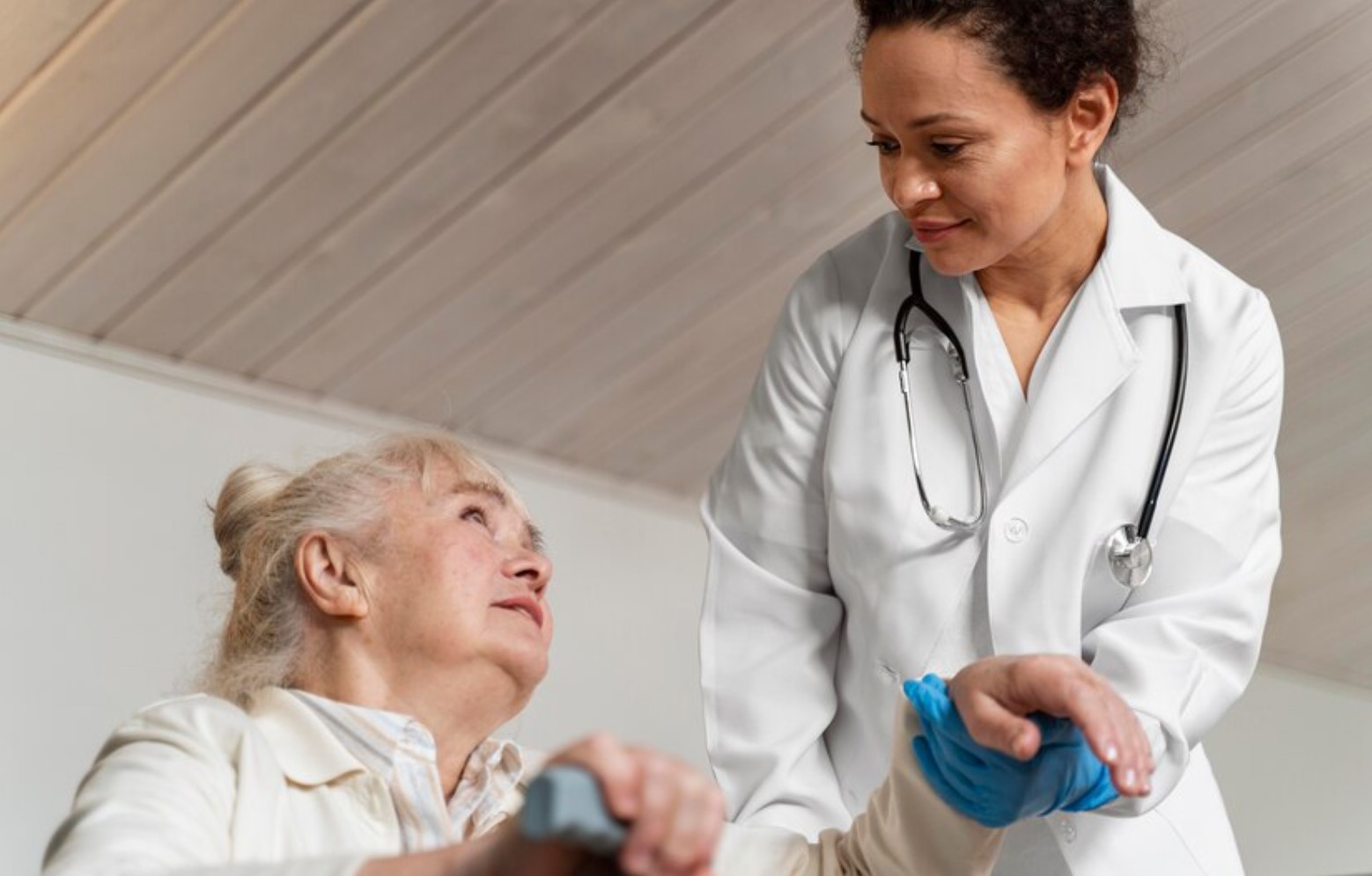 Nurse helping an elderly patient