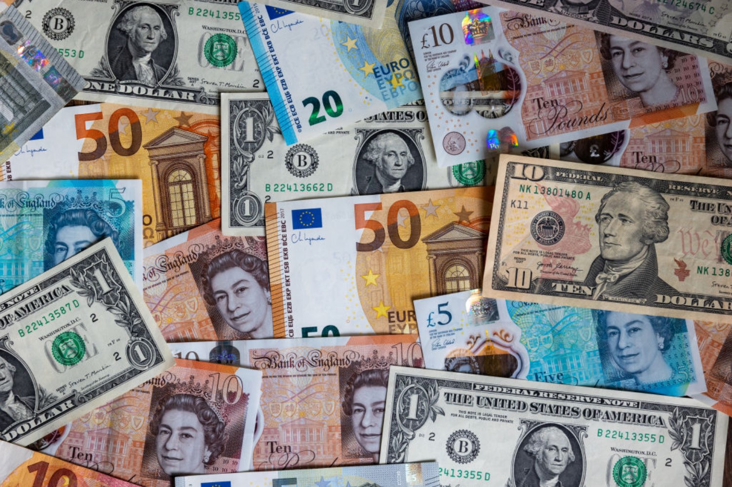 Photo of US dollar bills, British GDP, and Euros